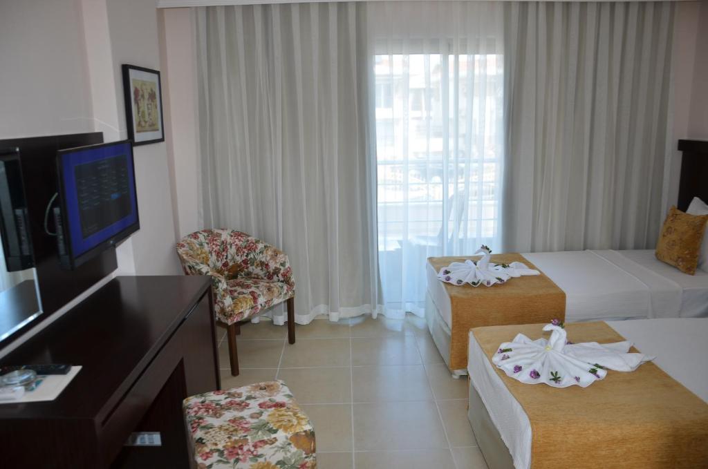 Postel nebo postele na pokoji v ubytování Erkal Resort Hotel