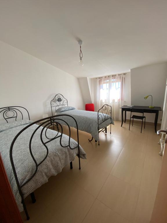 Posteľ alebo postele v izbe v ubytovaní Sunny Home:Palo del Colle