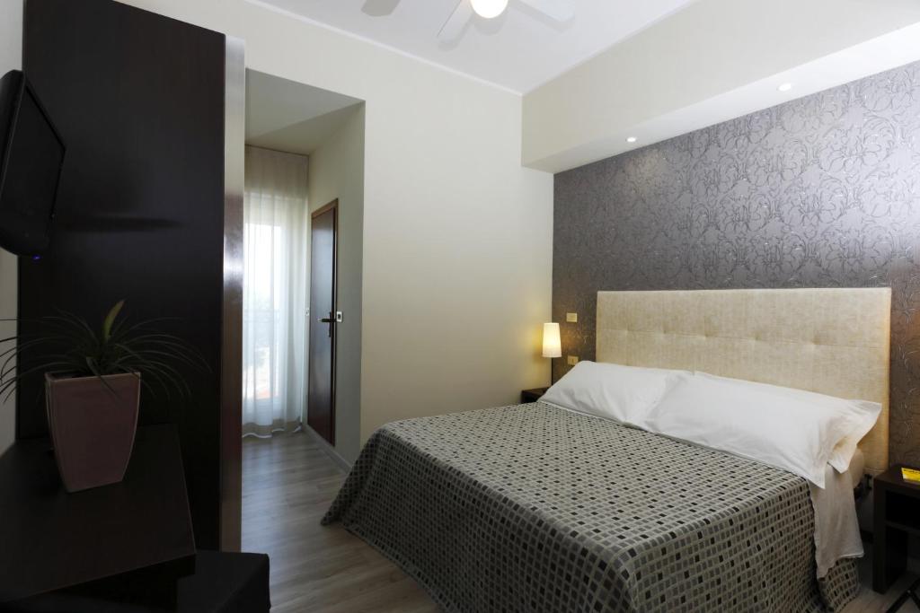 Postel nebo postele na pokoji v ubytování Hotel Gardenia