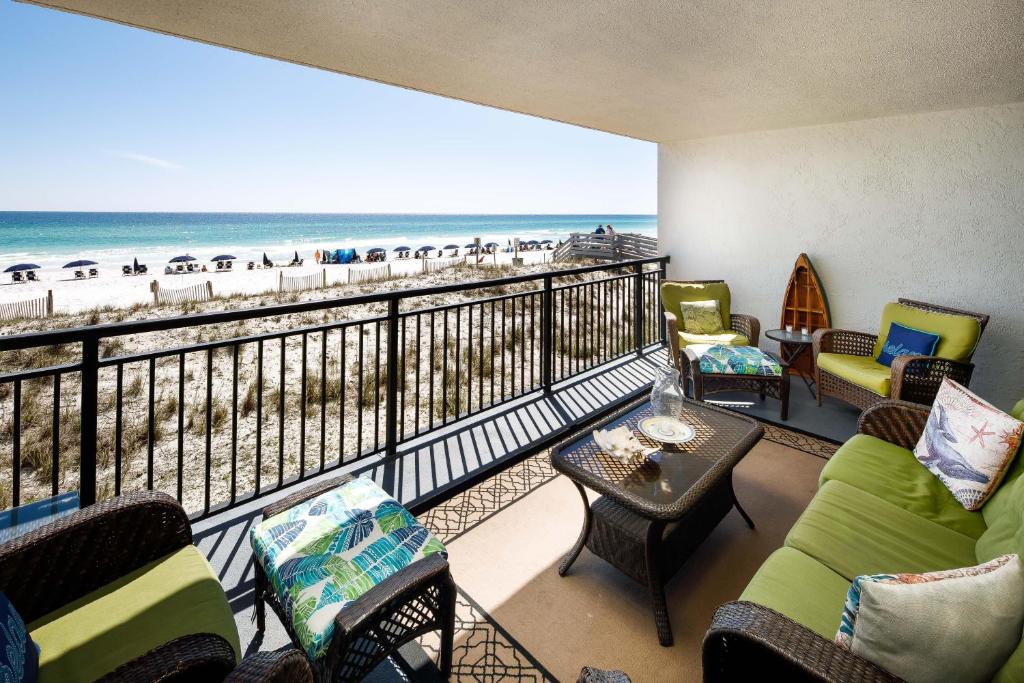 a balcony with a view of the beach at Nautilus 1203 - Gulf Front 2 Bedroom! 2nd Floor! Free Beach Service March to October in Fort Walton Beach