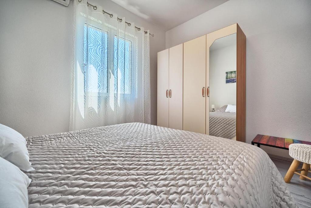 Postel nebo postele na pokoji v ubytování Apartments Irena