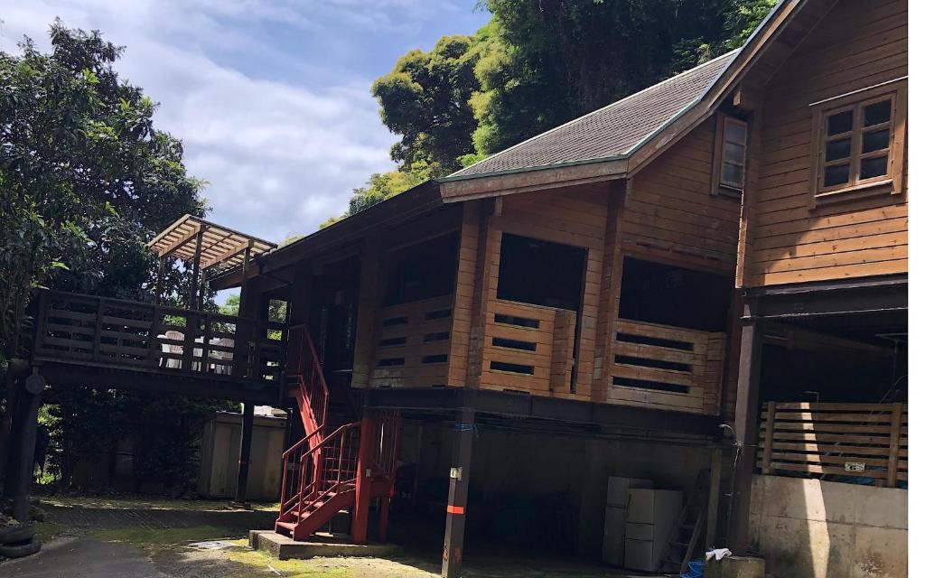 a large wooden house with a wooden deck at village yumigahama - Vacation STAY 49352v in Minato