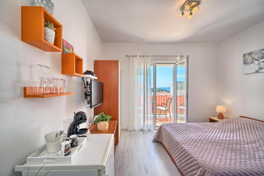Postel nebo postele na pokoji v ubytování Apartments Irena