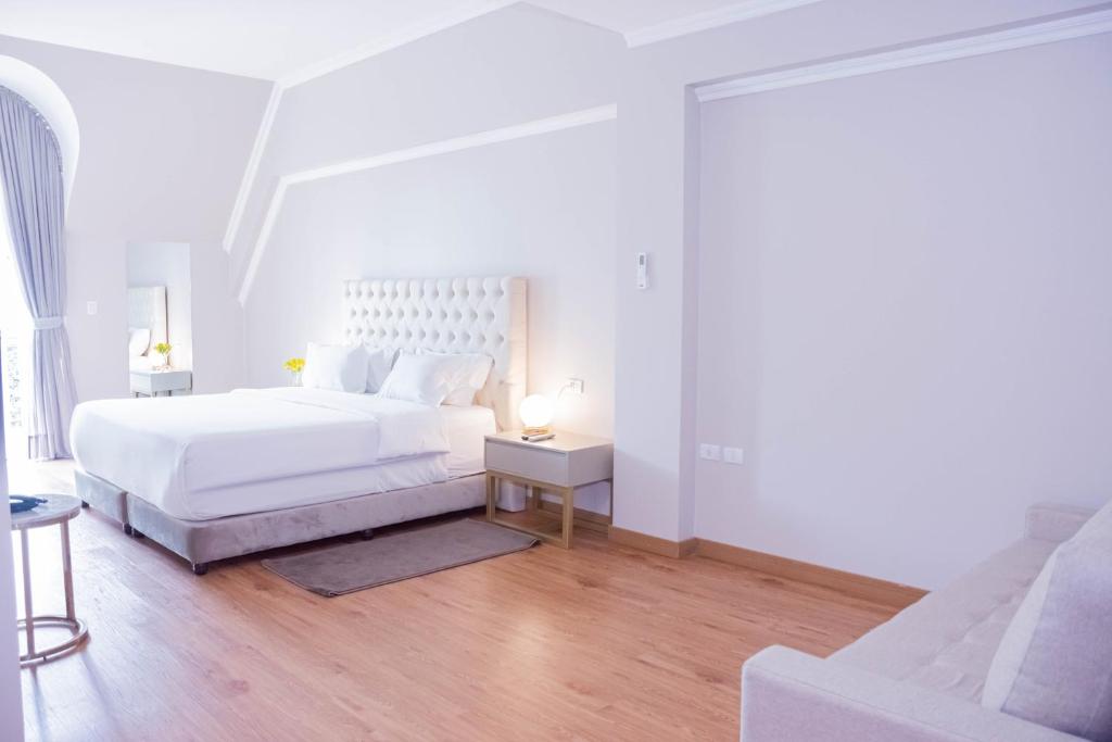 Postel nebo postele na pokoji v ubytování Bisinii Boutique Hotel