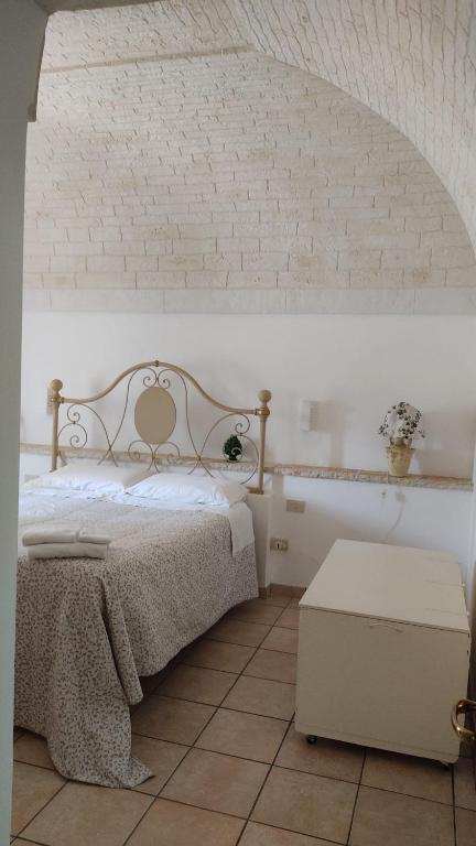 Postel nebo postele na pokoji v ubytování TRULLI DI ZIA TATA