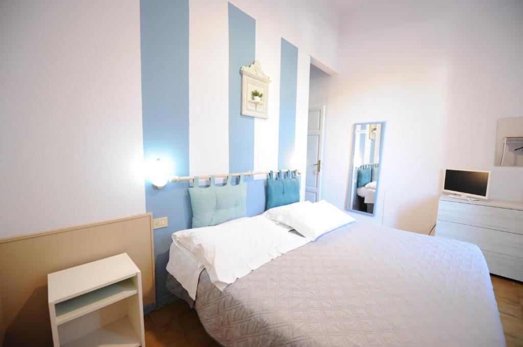 Postel nebo postele na pokoji v ubytování Hotel Le Giare