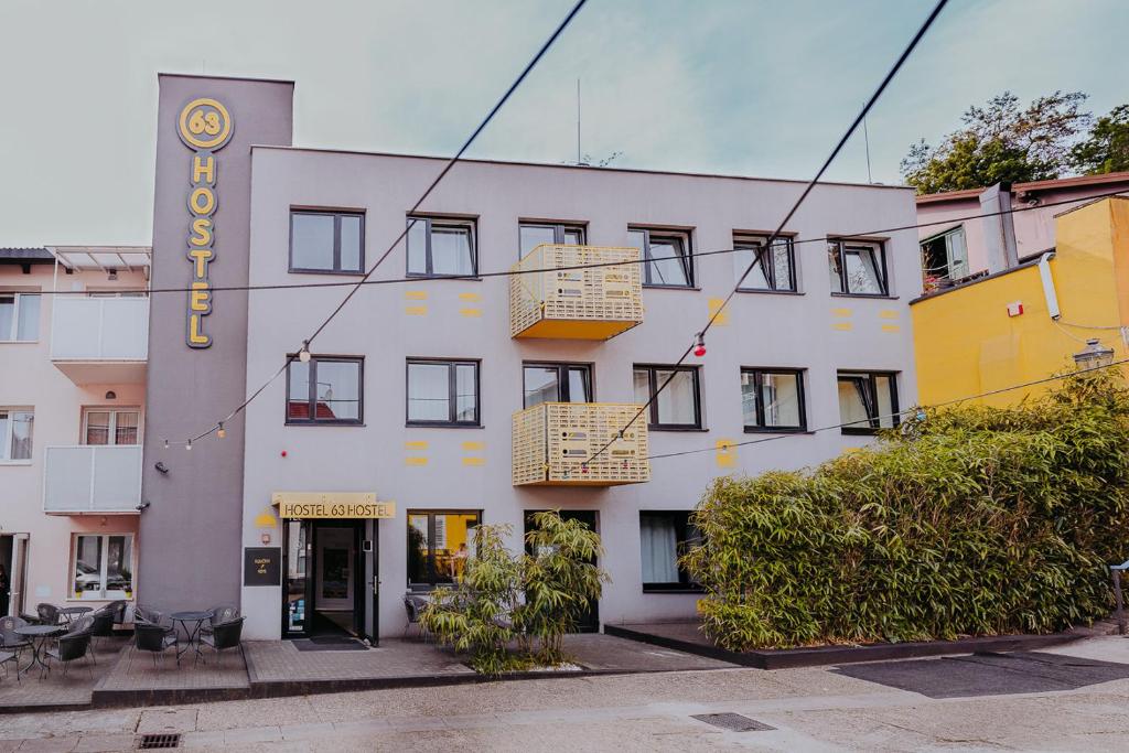 a large white building with two balconies on it at Private Rooms at Hostel63 in Zagreb