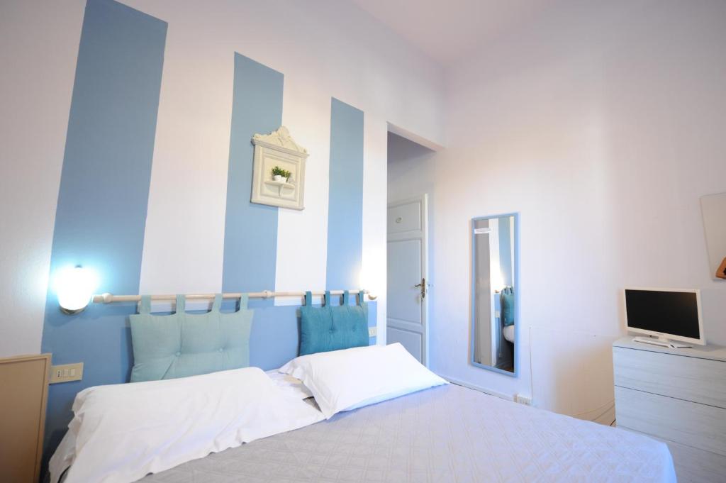 Postel nebo postele na pokoji v ubytování Hotel Le Giare