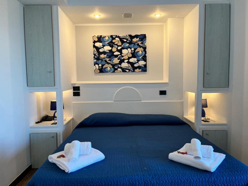 Postel nebo postele na pokoji v ubytování Hotel La Plancia