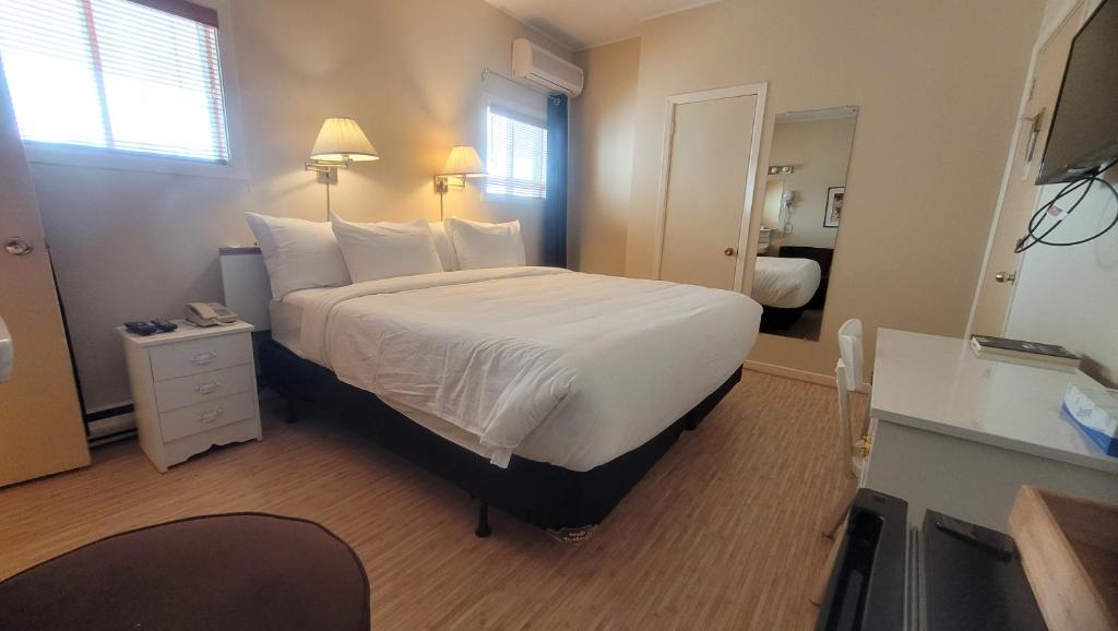 Postel nebo postele na pokoji v ubytování Hôtel Aquamer