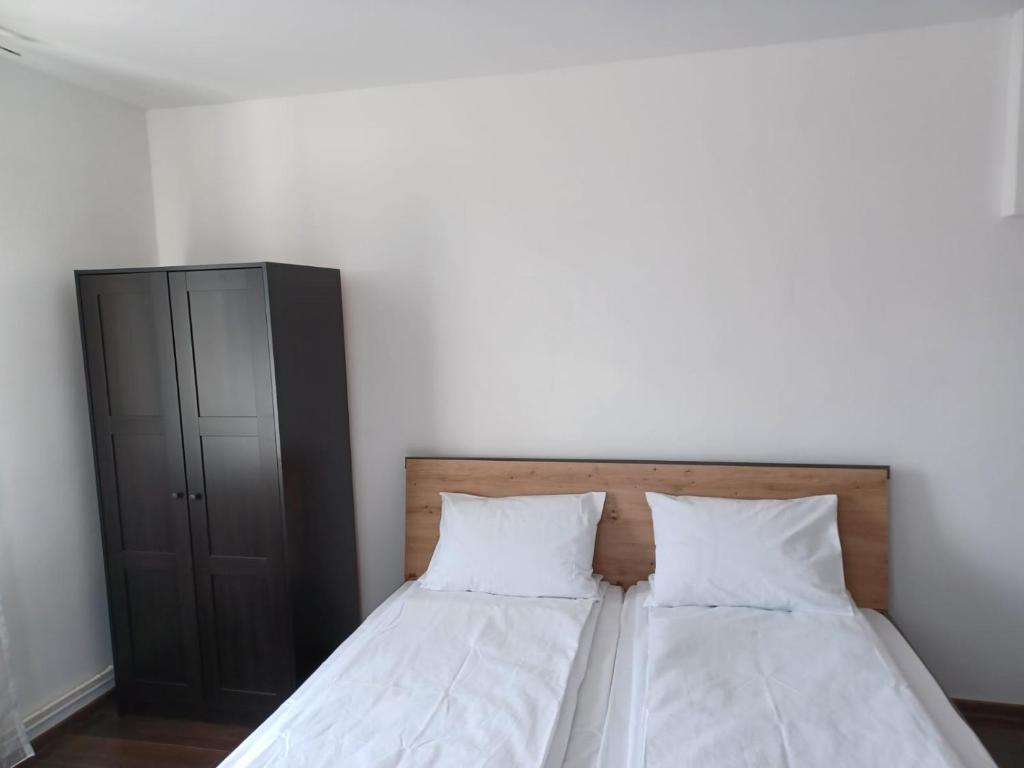 Postel nebo postele na pokoji v ubytování Vila Oltețul