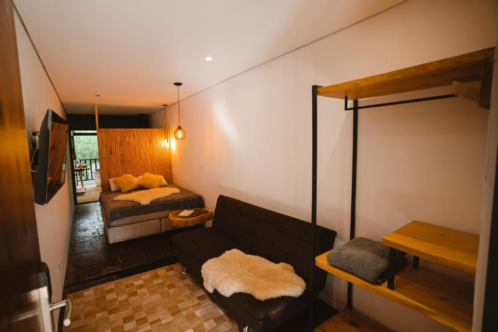 Llit o llits en una habitació de Reserva Campos do Jordão