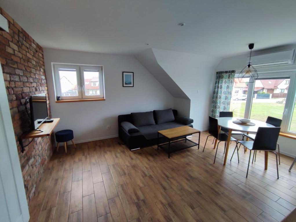 Posezení v ubytování SOWI KĄT domki i apartamenty