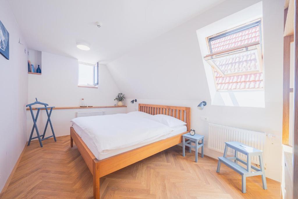 Postel nebo postele na pokoji v ubytování Vlaštovčí dům