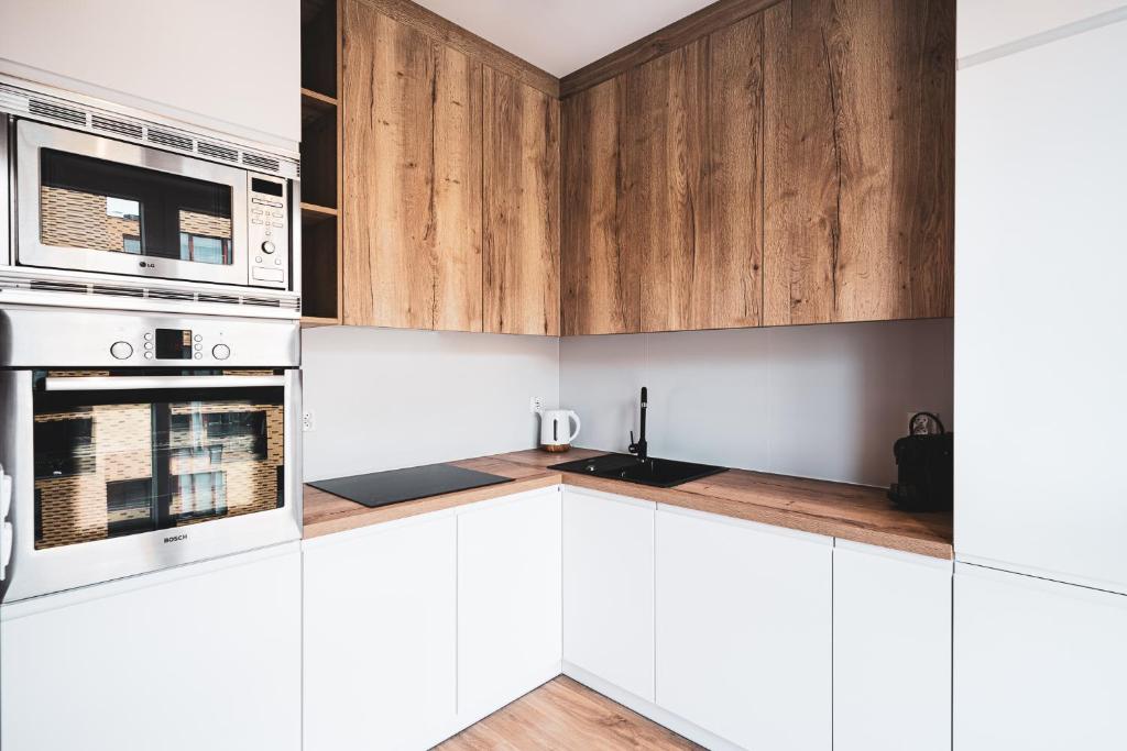 Kuchyň nebo kuchyňský kout v ubytování Pure Rental Apartments Inżynierska