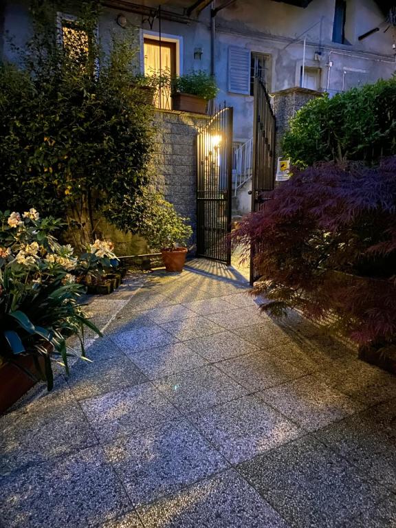 a walkway in front of a house at night at Love Family in Vignone