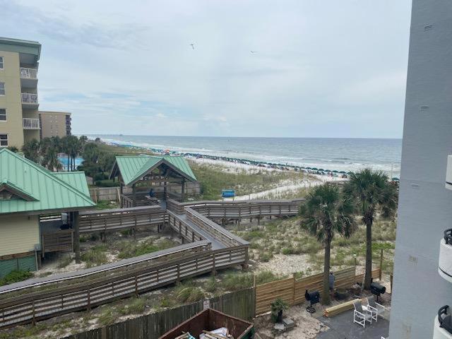 a view of a beach with a building and the ocean at Nautilus 2407 Gulf View 2 Bedroom 4th Floor Free Beach Service in Fort Walton Beach