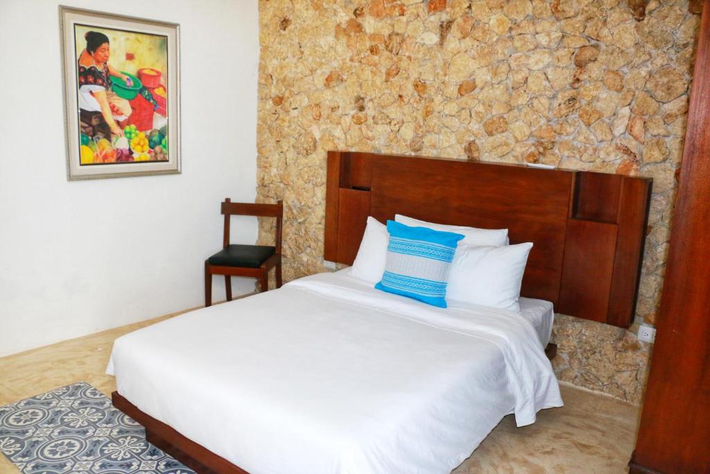 Postel nebo postele na pokoji v ubytování Boutique Casa Azuli Santiago