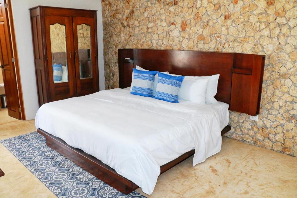 Postel nebo postele na pokoji v ubytování Boutique Casa Azuli Santiago