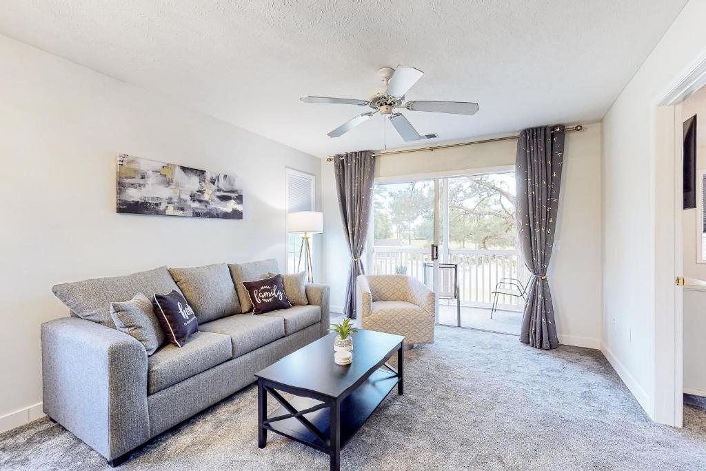 a living room with a couch and a table at River Oaks 40D in Myrtle Beach