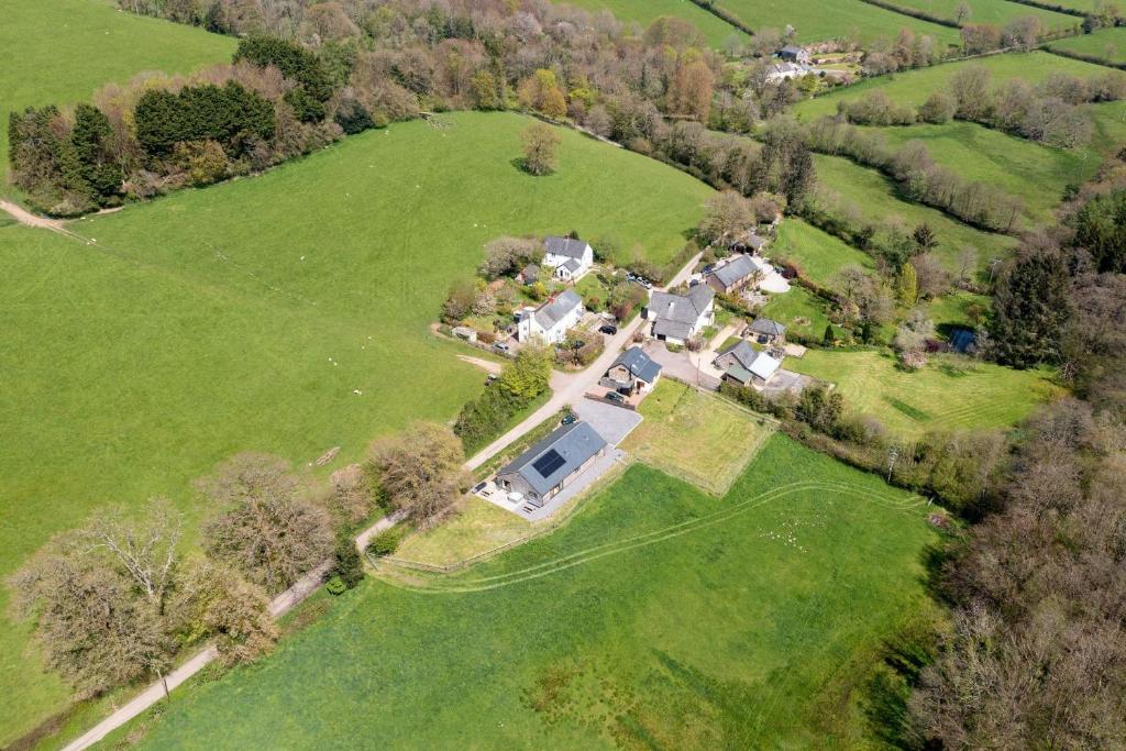 an aerial view of a house in a field at Sunset Barn in Dulverton