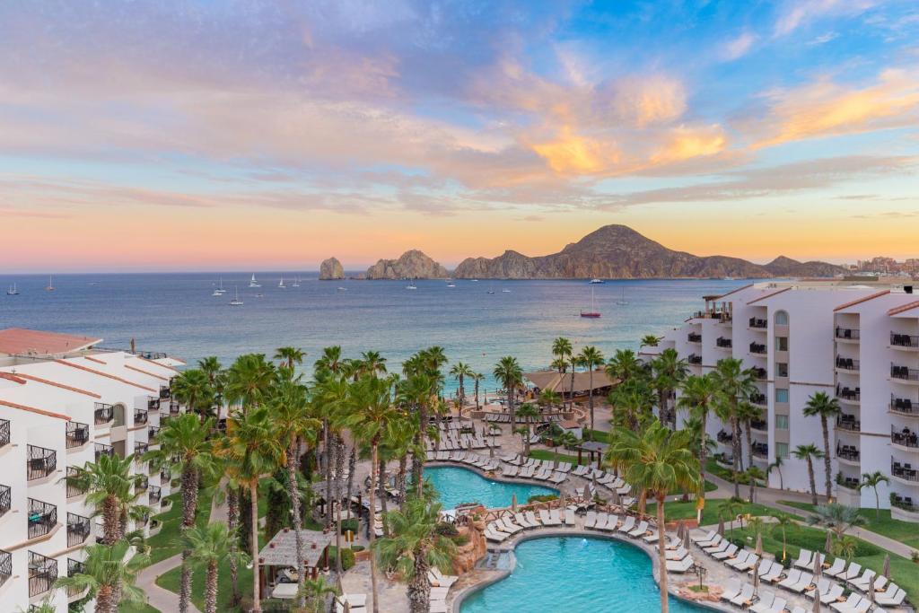 an aerial view of a resort with palm trees and the ocean at Villa del Palmar Beach Resort & Spa in Cabo San Lucas