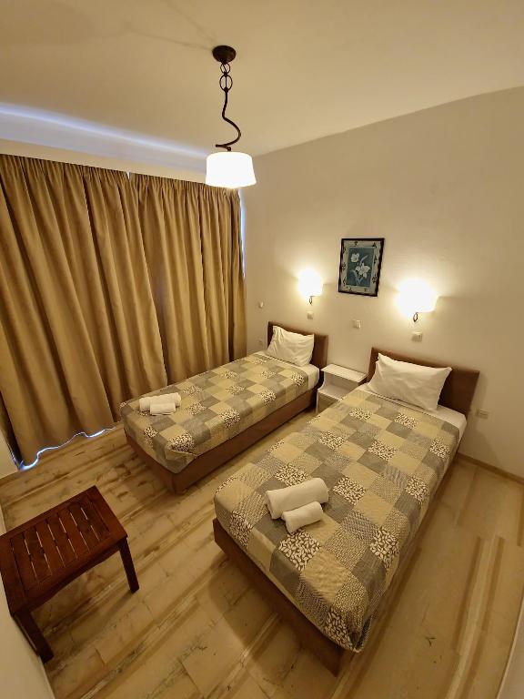 A bed or beds in a room at Alexandra Apartment 1
