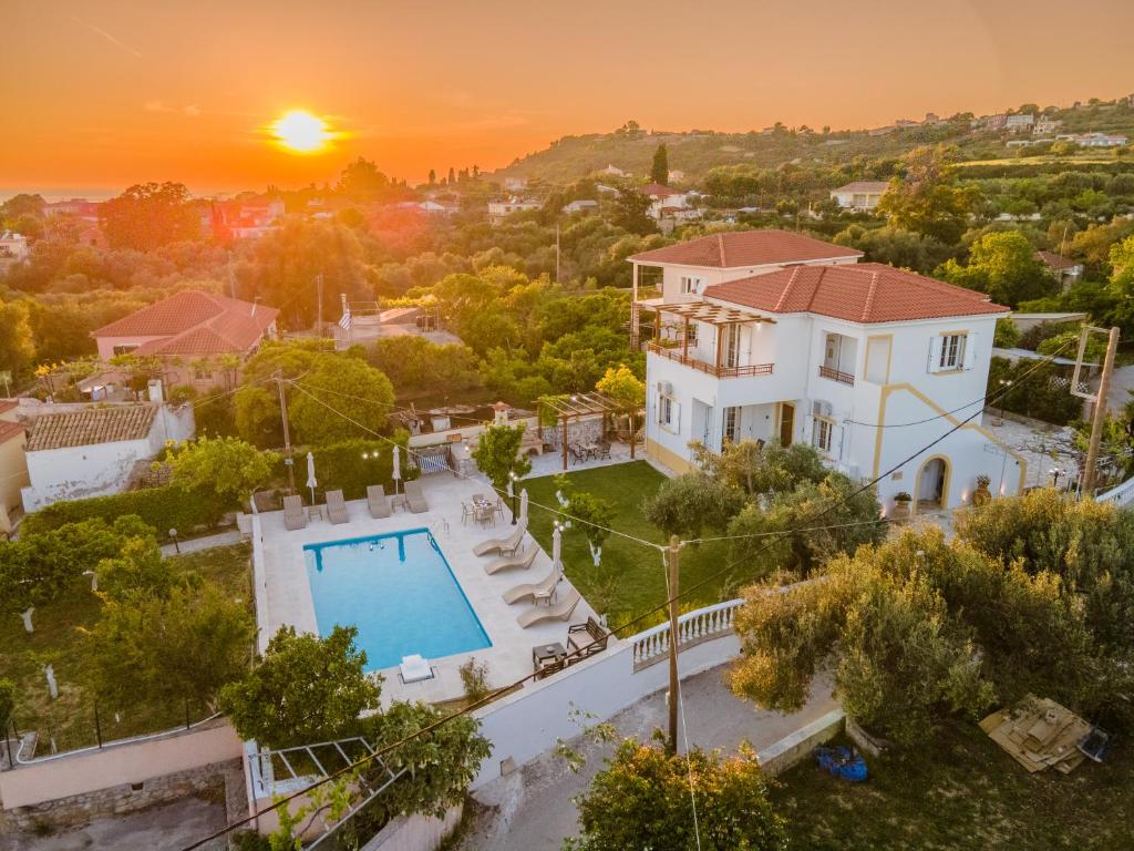 an aerial view of a house with a swimming pool at Villa Erasmia- House 1 ground floor in Sarláta