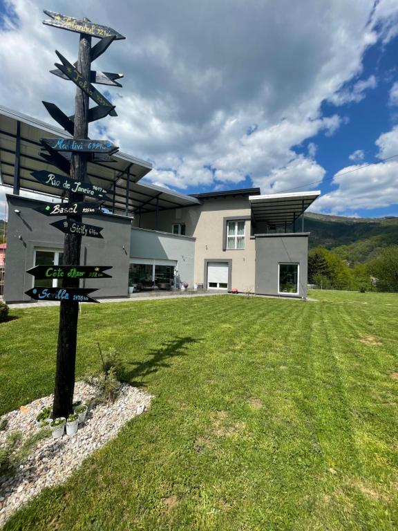 a street sign in front of a house at Villa Nature in Sarajevo