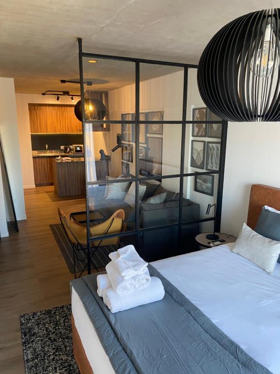 ブエノスアイレスにあるPalermo Jaiのベッドルーム1室(ベッド1台付)、リビングルームが備わります。