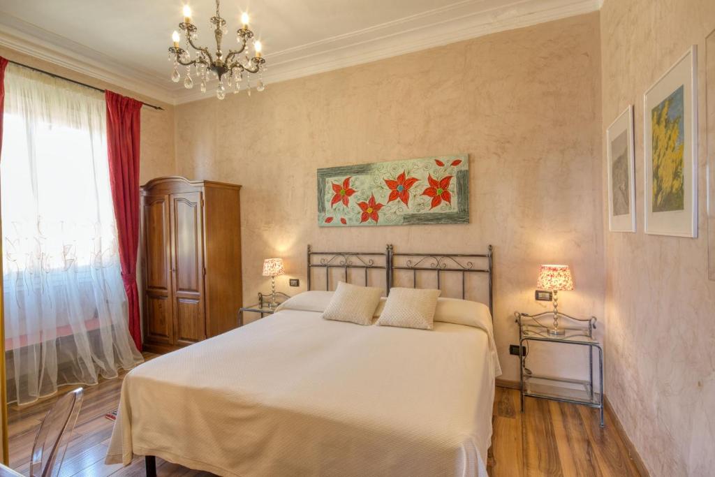 Ein Bett oder Betten in einem Zimmer der Unterkunft Locanda Villa Moderna