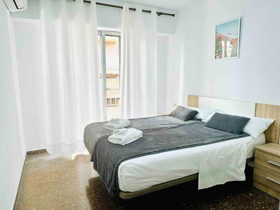 A bed or beds in a room at Citadella Apartment