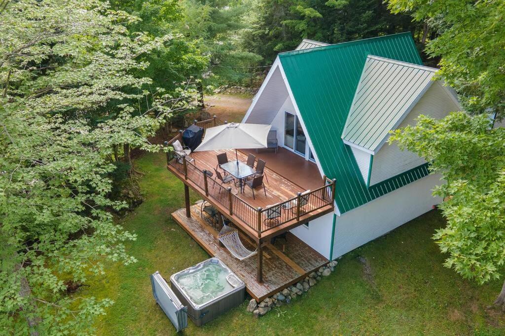an overhead view of a house with a deck at Eastern Township's Getaway! Beach + Ski Haven in Magog-Orford