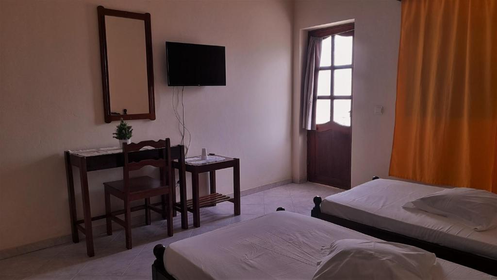 Postel nebo postele na pokoji v ubytování Residencial Rosa Criola