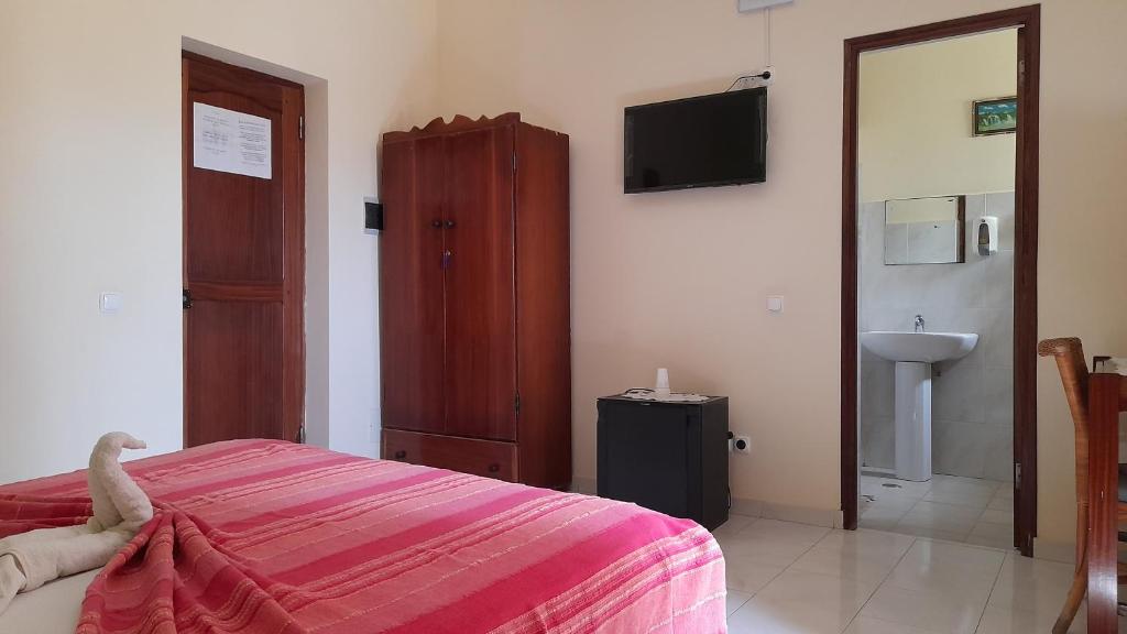 Postel nebo postele na pokoji v ubytování Residencial Rosa Criola