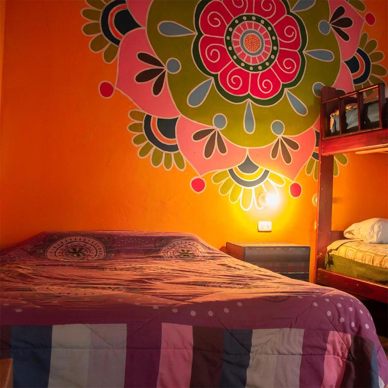 Postel nebo postele na pokoji v ubytování Hostal Café Tiana