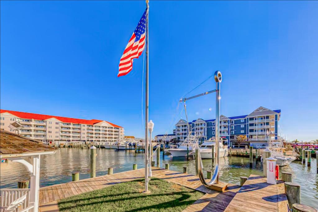 a american flag on a dock next to a marina at White Marlin 202A in Ocean City