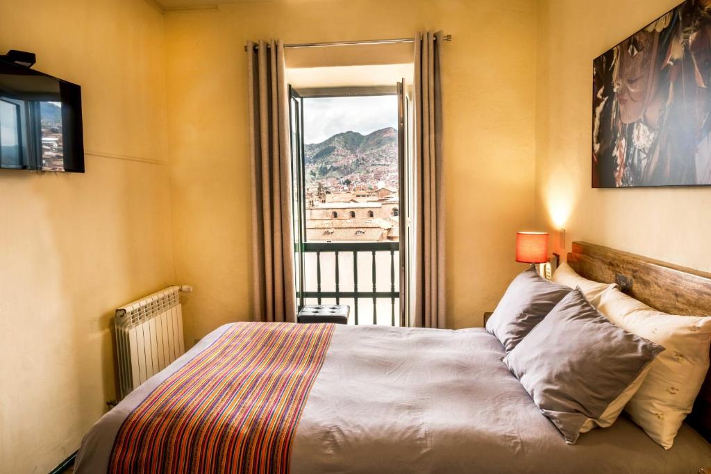 Postel nebo postele na pokoji v ubytování Hostal Corihuasi