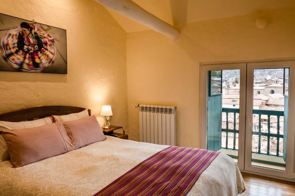 Postel nebo postele na pokoji v ubytování Hostal Corihuasi