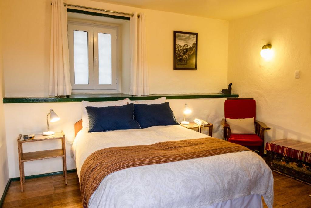 Postel nebo postele na pokoji v ubytování Hostal Corihuasi