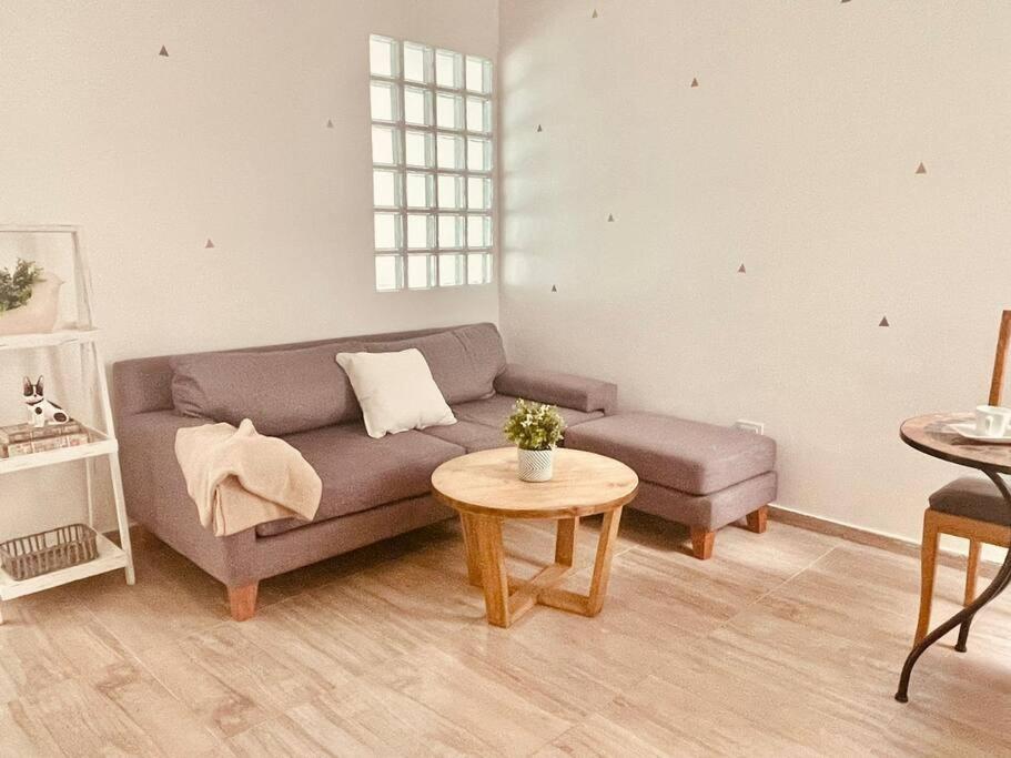 a living room with a couch and a table at Lovely one bedroom apartment in Vicente Lopez in Vicente López