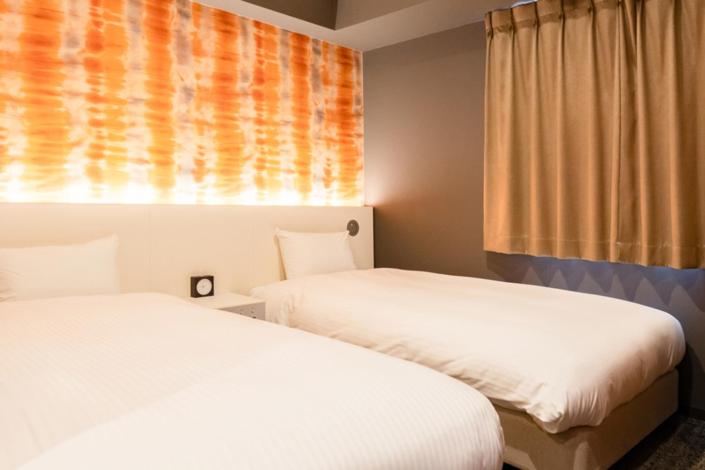 Postel nebo postele na pokoji v ubytování Cinnamonhotel2