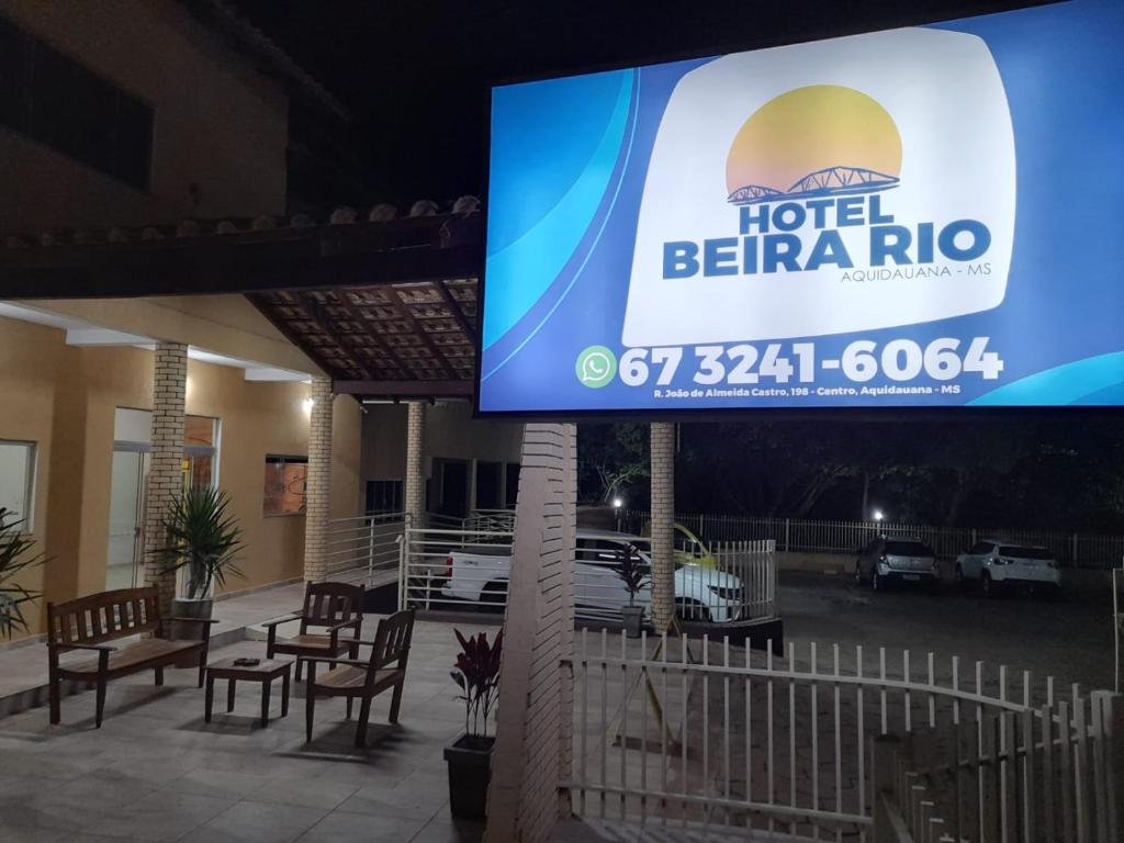 a large screen with a hotel beirirro on it at Hotel Beira Rio in Aquidauana