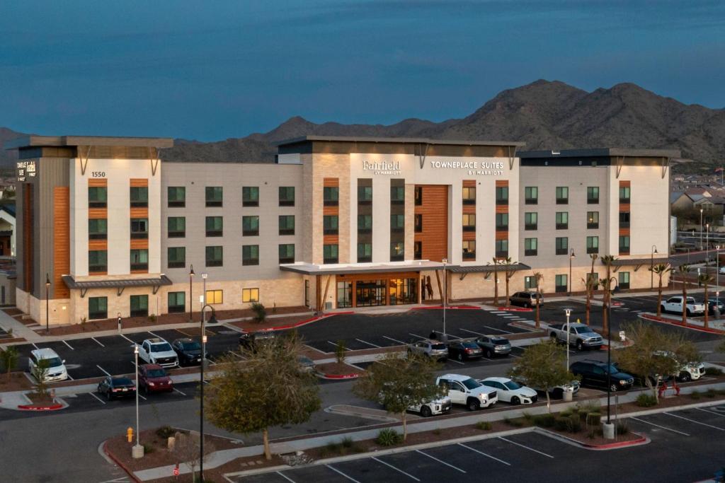 a large building with a parking lot in front of it at TownePlace Suites by Marriott Buckeye Verrado in Buckeye