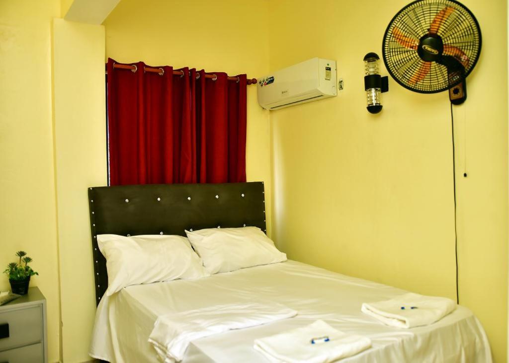 Postel nebo postele na pokoji v ubytování Hotel Freedom Nagua