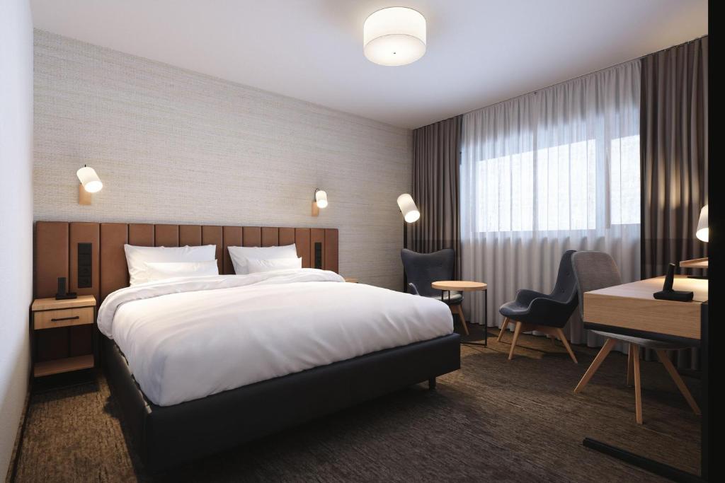 Postel nebo postele na pokoji v ubytování Four Points by Sheraton Warsaw Mokotow