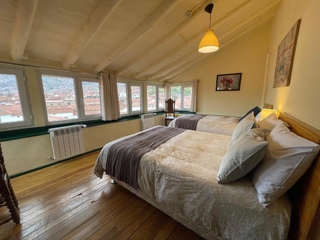 Postel nebo postele na pokoji v ubytování Hostal Corihuasi