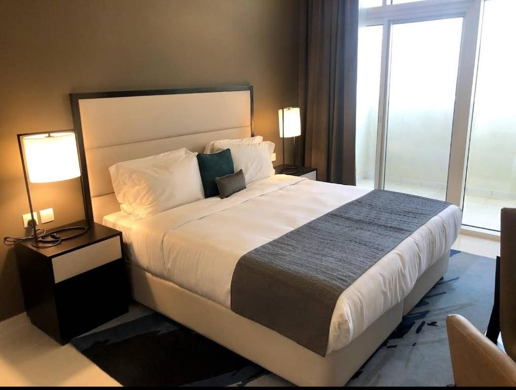 Postel nebo postele na pokoji v ubytování Damac 108 tower