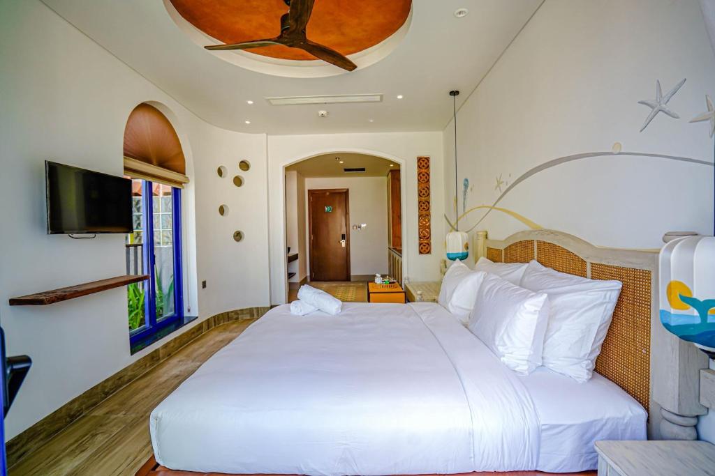 Giường trong phòng chung tại Seahorse Signature Danang Hotel by Haviland
