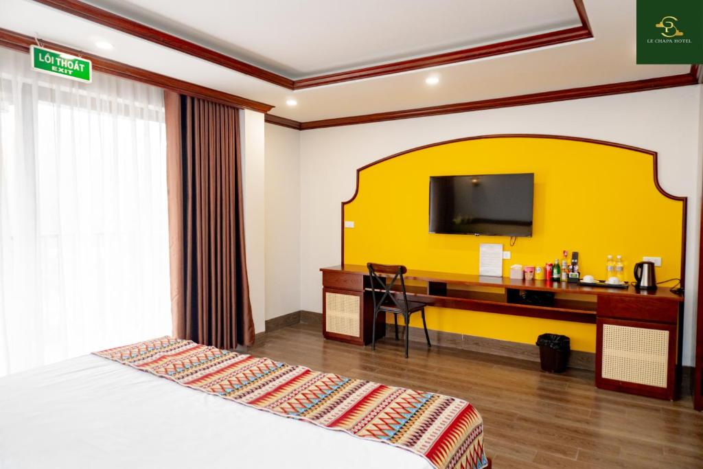 TV a/nebo společenská místnost v ubytování Le Chapa Hotel & Spa